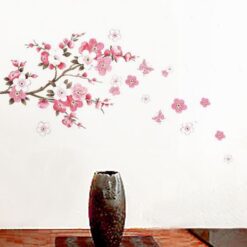 Muursticker met tak, roze bloemen en vlinders